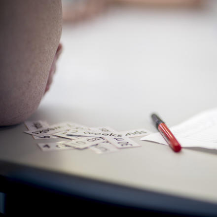 Word cut outs sit on a desk
