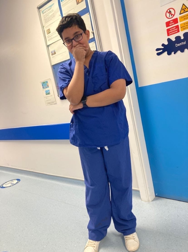 Pupil in doctors uniform at a hospital