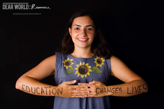 Teach First Ambassador with 'Education changes lives' written on her arms.