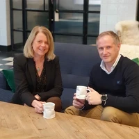 Helen O'Connor and Michael Britland drinking tea