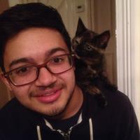 Image of Umair with his cat