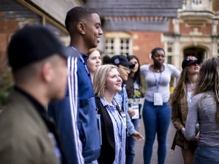 A group of young adults standing outside