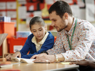 Teacher with pupil