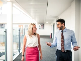 Two teachers talking in the school hallway