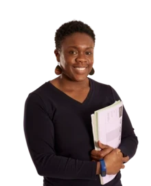School leader carries work and smiles