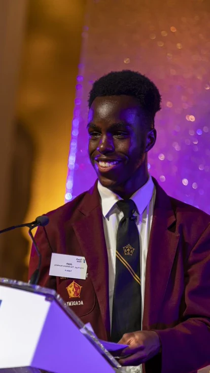 Student speaks on stage at the Teach First Gala Dinner