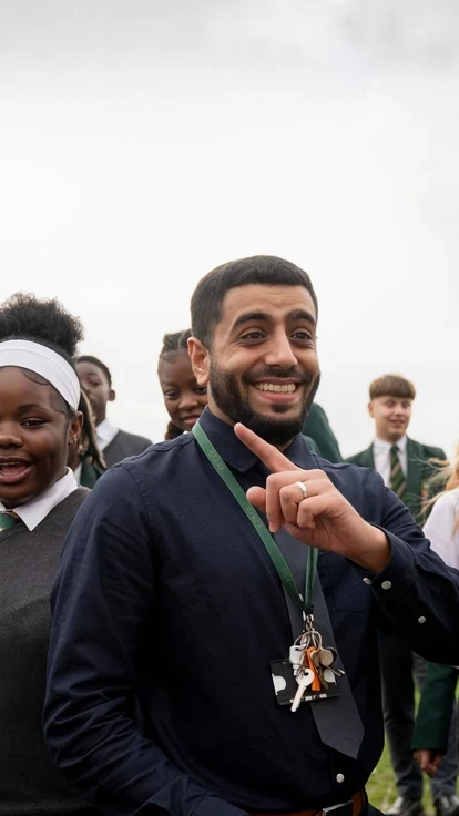 Teacher standing outside with a group of students