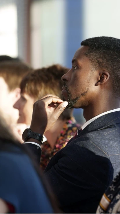 Attendees listening during a professional networking event.