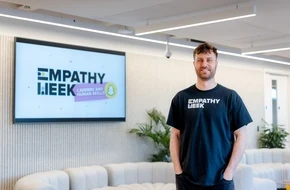 Ed Kirwan standing in front of a presentation screen.