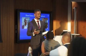 Speaker presenting to an audience at a Teach First event.